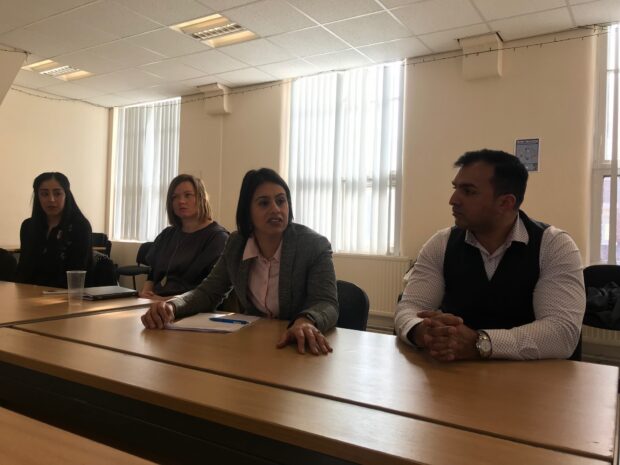 Picture of Sara Khan and three other people sitting at a table